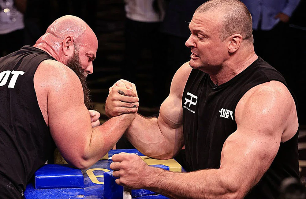 Devon Larratt at the table in an East vs West match